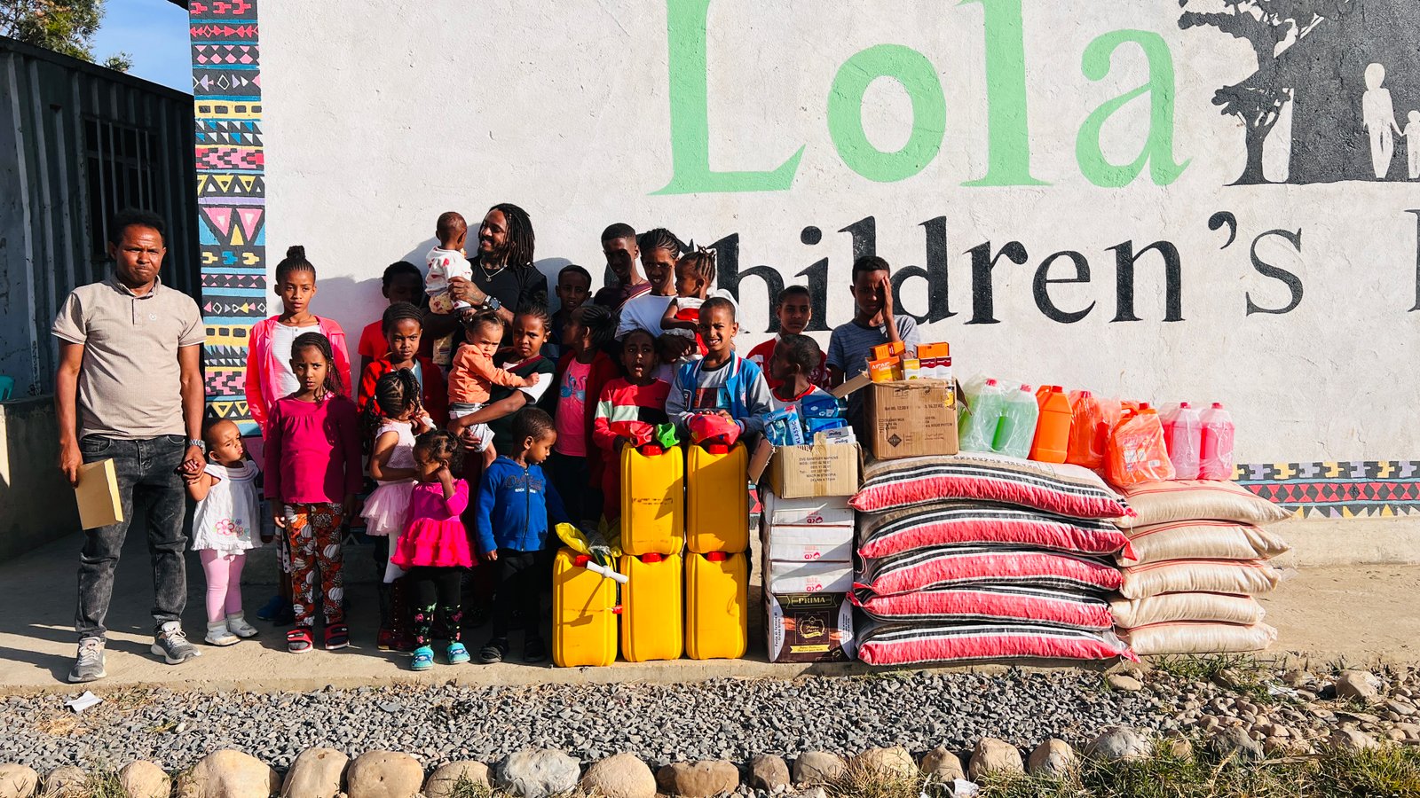 Tom Berhane donating supplies to an orphanage in Ethiopia